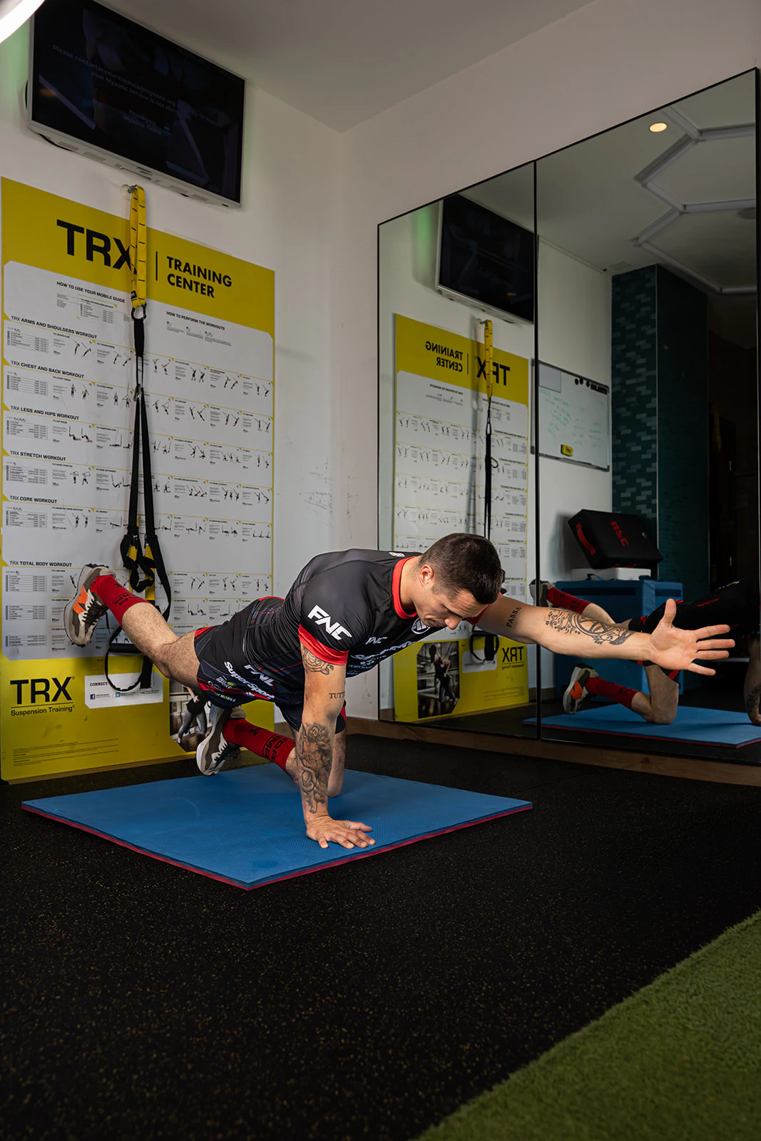 Plank reach — core stability